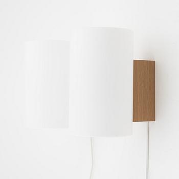 A pair of oak and acrylic wall lights, Luxus, Vittsjö.