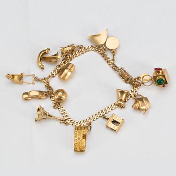 ARMLÄNK, 18k guld med 14 st berlocker. Waleby Juvelerare Oskar, Stockholm, 1945. Vikt ca 29 g.