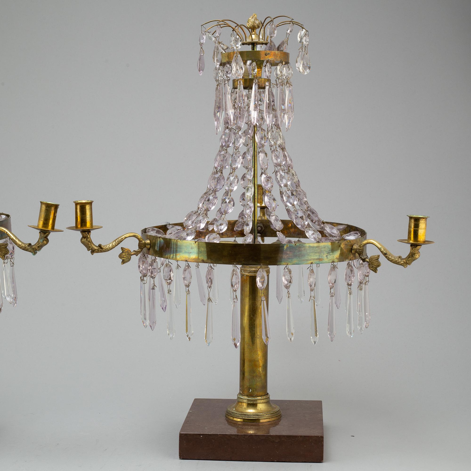 A pair of late Gustavian style three-light candelabra.