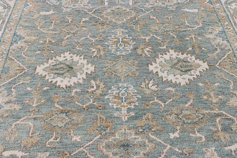 An oriental carpet with Mamluk design, c. 304 x 249 cm.