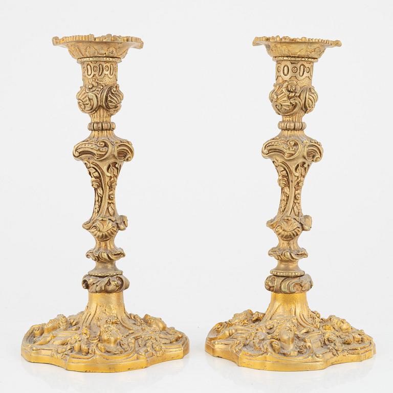 A pair of gilt bronze candle sticks, end of the 19th Century.