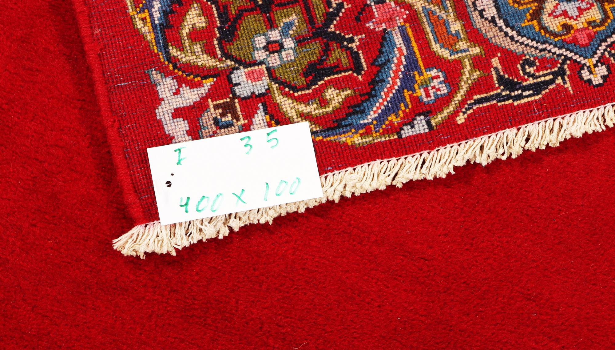 A Royal Keshan runner, c. 400 x 100 cm.