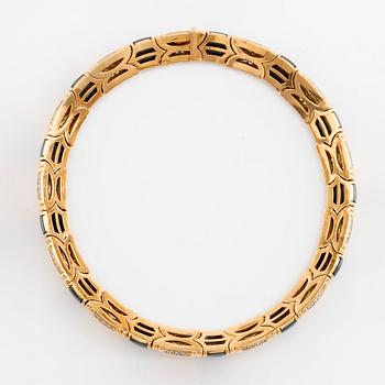 A Bulgari 18K gold and hematite necklace set with round brilliant-cut diamonds.