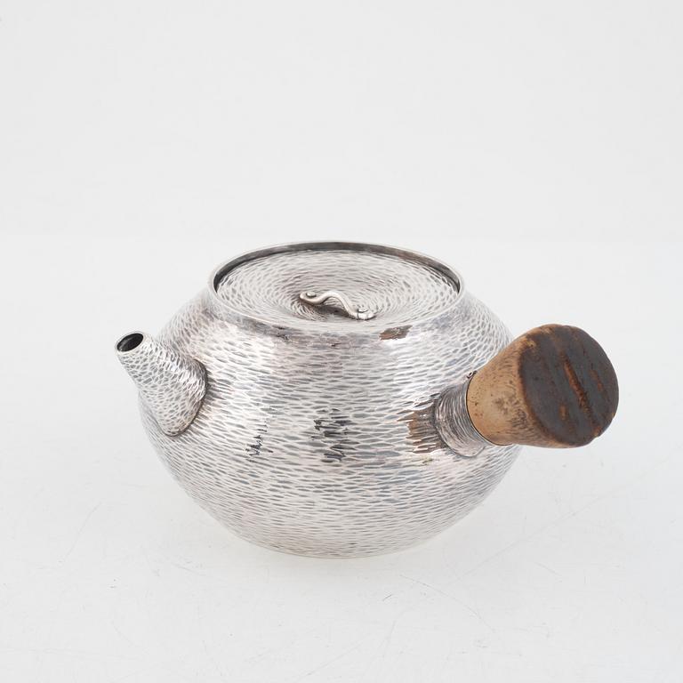 A silver teapot, first part of the 20th century.