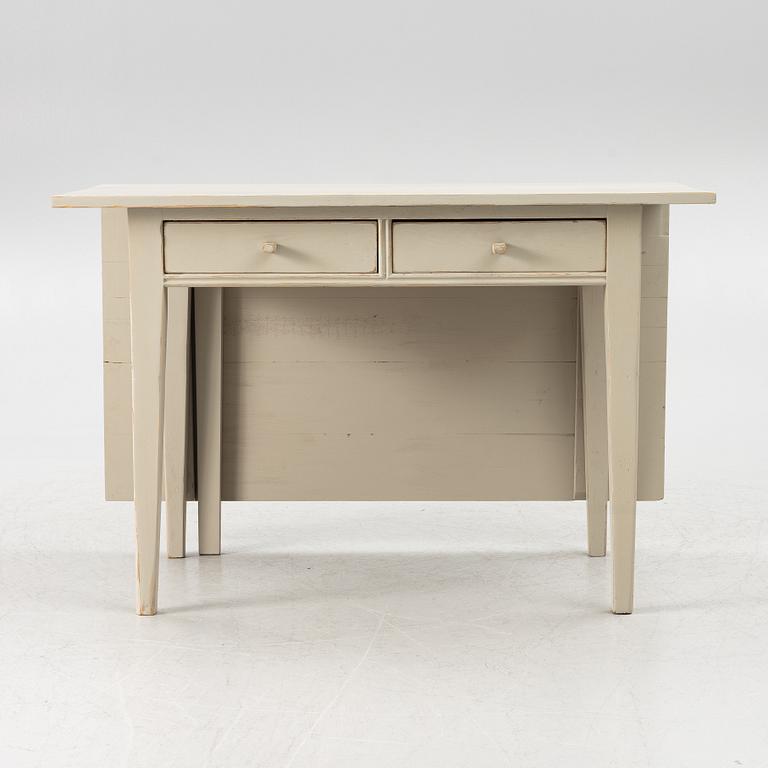 A drop-leaf table, late 19th century.