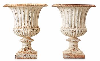 1705. A pair of English 1860's iron garden urns.