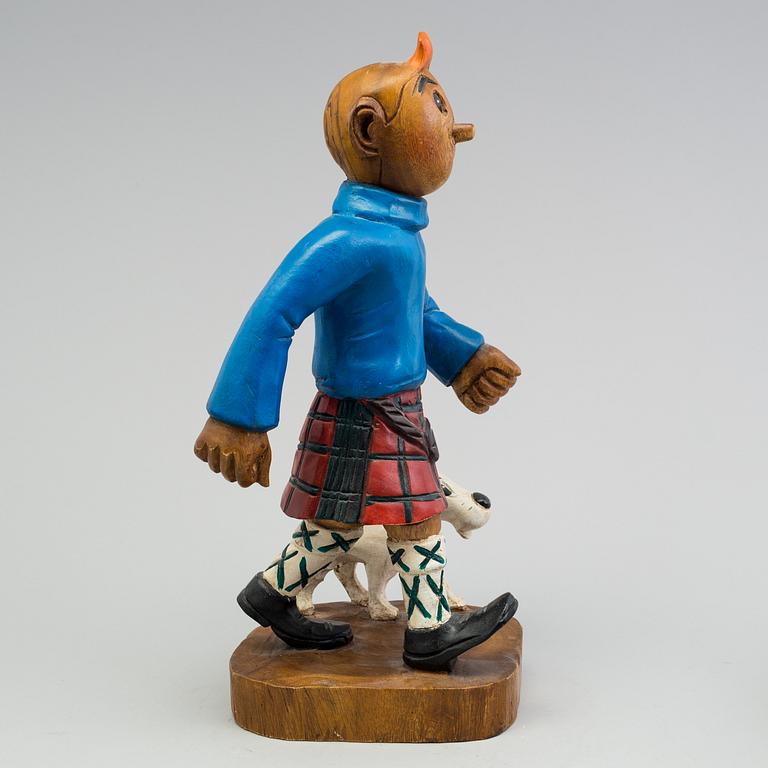 a Tintin and snowy wood scuplture from the second half of the 20th century.