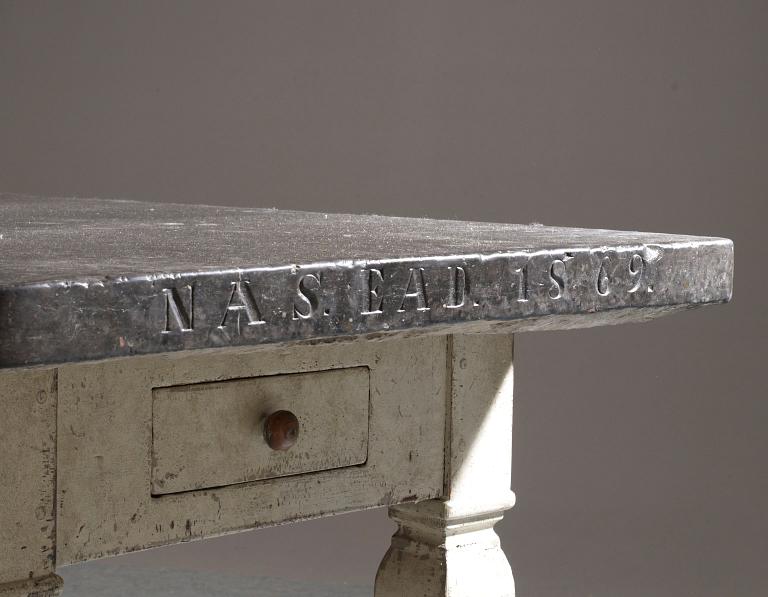 A Swedish stone top table dated 1869.