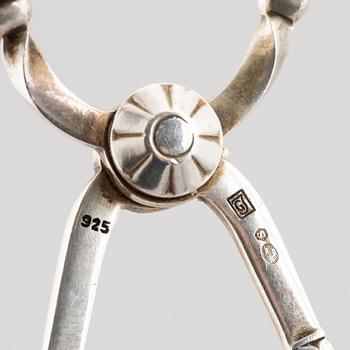 A sterling silver sugar tongs, mark of Georg Jensen, Denmark 1933-44.