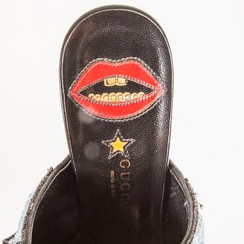 Gucci,.