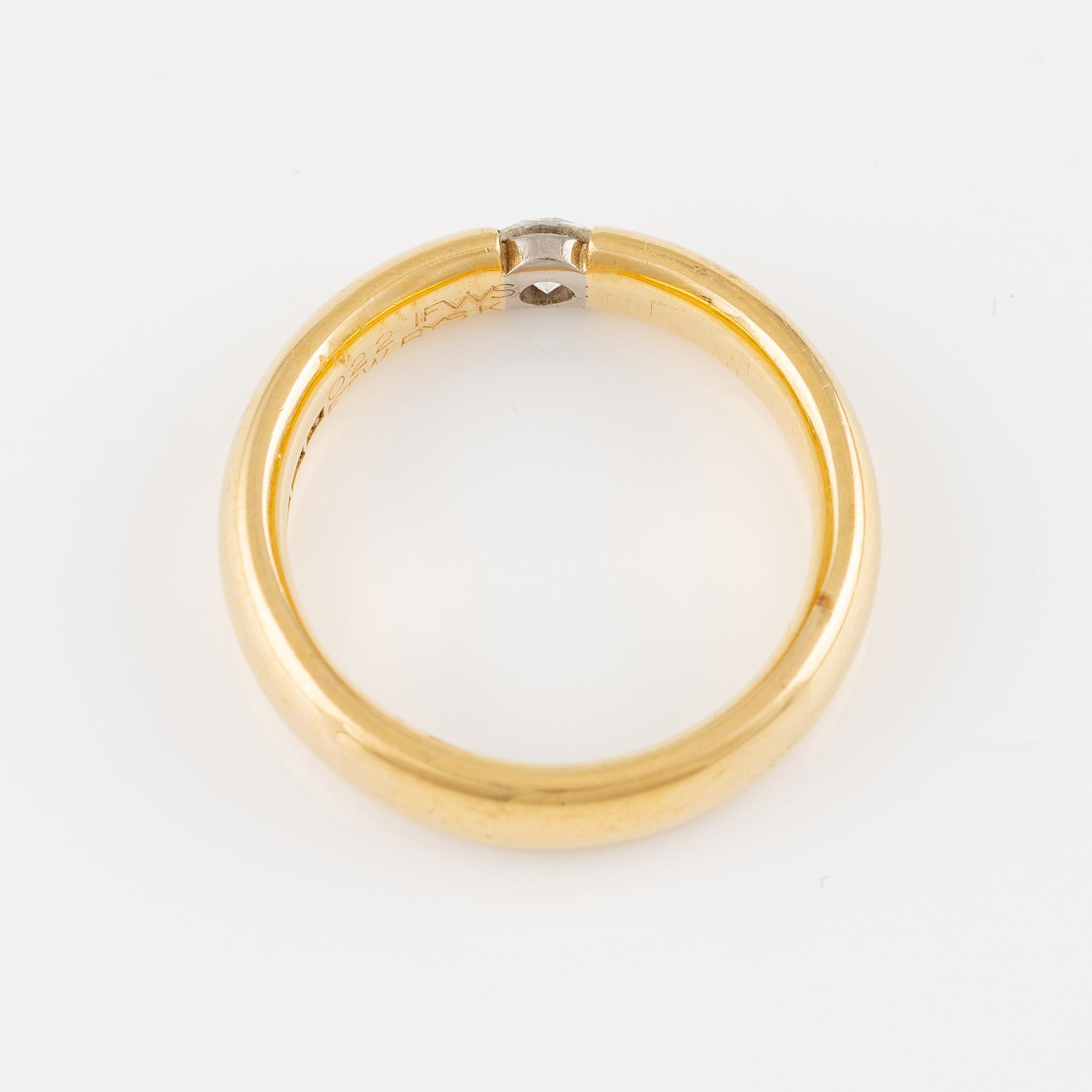 Ring 18K guld med en rund briljantslipad diamant.