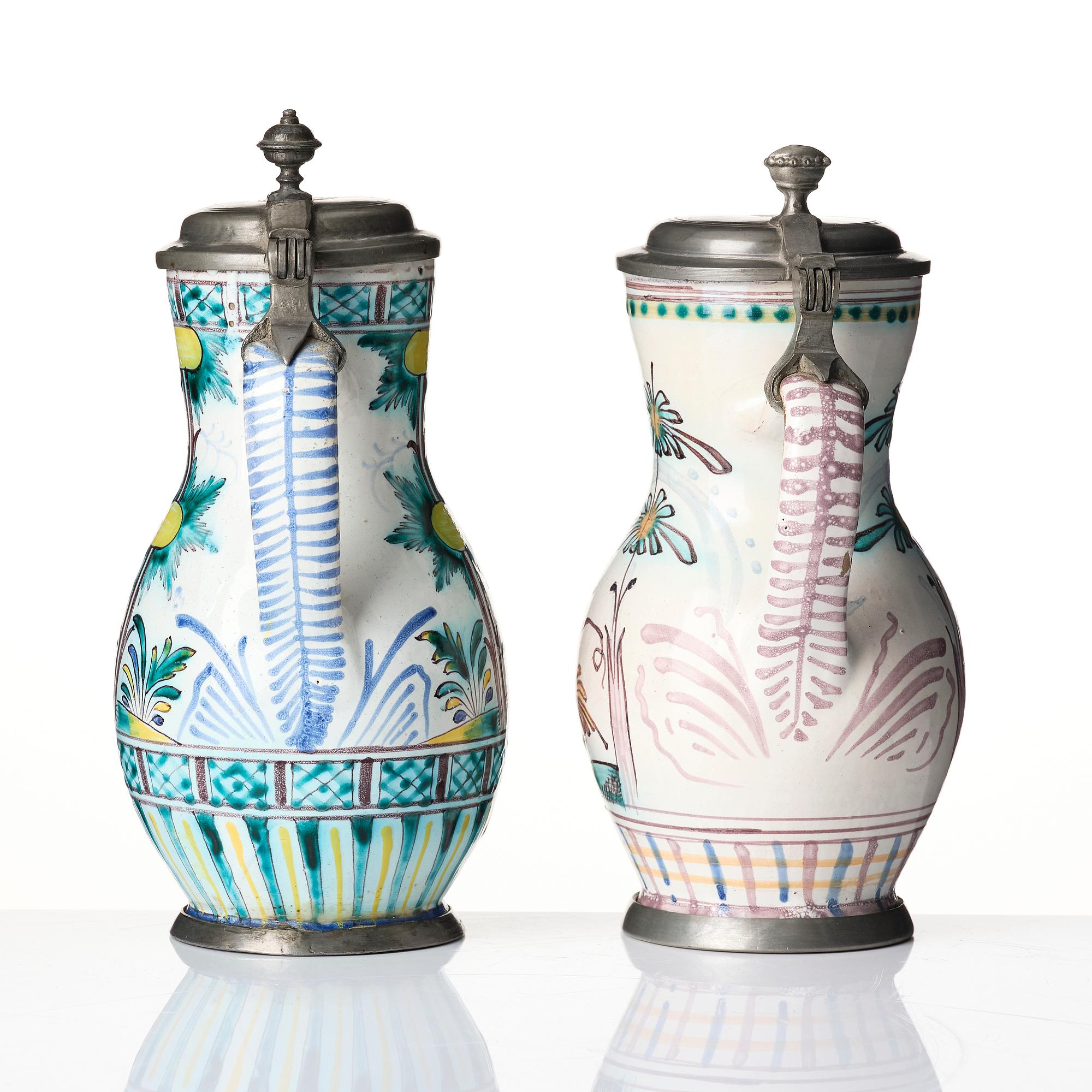 Two Dutch faience tankards with pewter lids, Delft, 18th century.