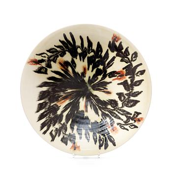 112. JEAN BESNARD, a glazed ceramic charger, France, signed and dated 1925.