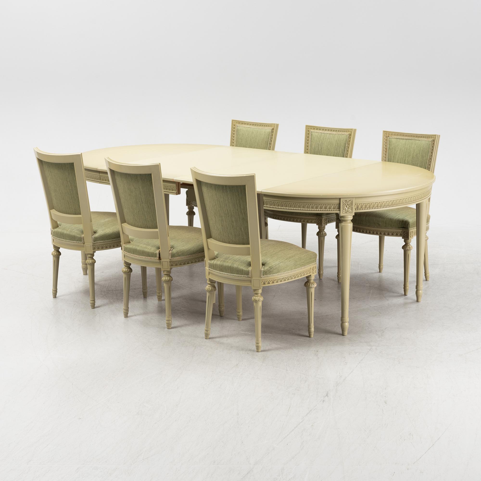 A Gustavian dining table with six chairs. Åmells dated 1974.