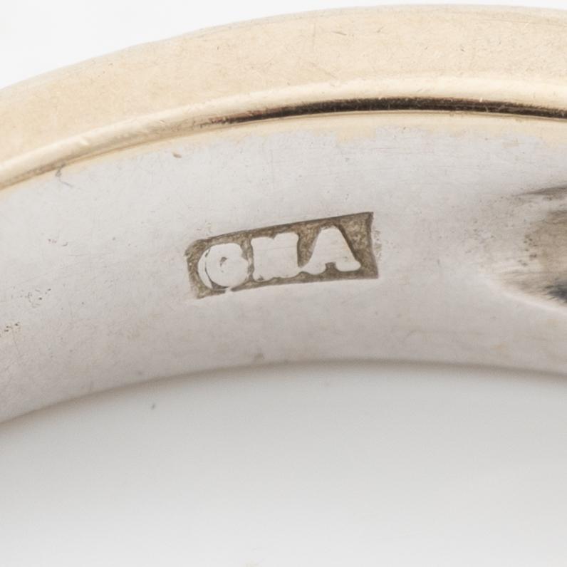 Three rings, 18K white gold with brilliant-cut and princess-cut diamonds.