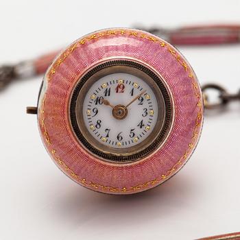 A necklace with a watch. Made of silver and with enamel. Early 20th century.