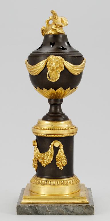 A Louis XVI table urn.