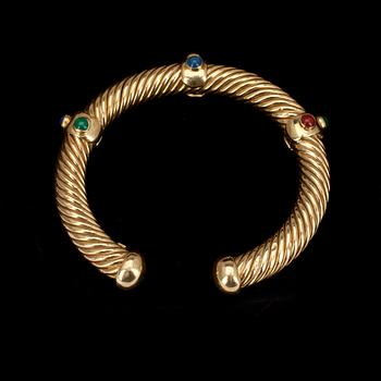 ARMBAND, 18 k guld med färgade stenar, 1900-talets senare hälft, vikt 35,5g.