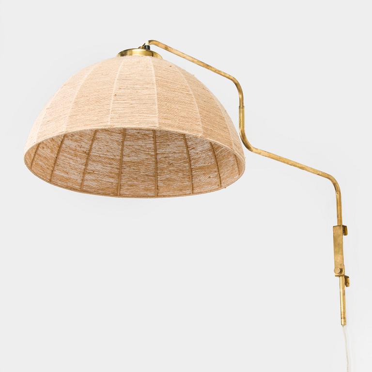 A mid-20th century wall light for Valinte, Finland.