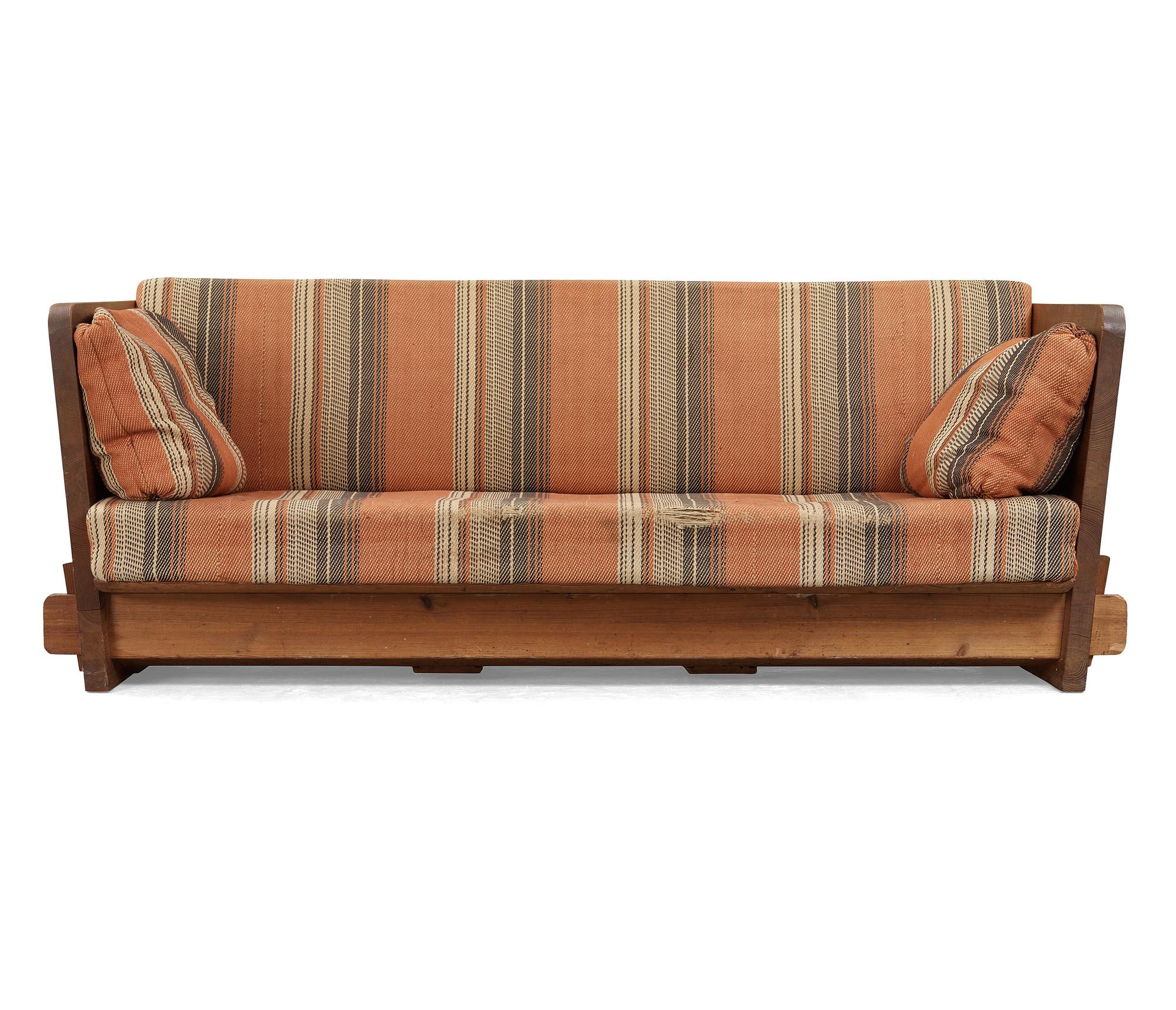 An Axel Einar Hjorth stained pine 'Lovö' sofa, Nordiska Kompaniet, Sweden ca 1930.