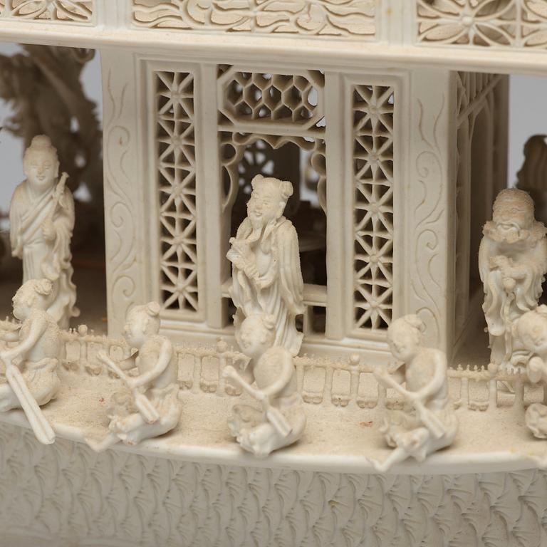 A biscuit porcelain dragon boat of 'Assembly of Immortals', Qing dynasty, Daoguang, signed Chen Guozhi, 19th century.