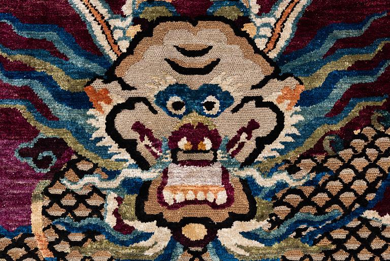 A Chinese silk and metal-thread 'Dragon' pillar rug, Bejing, North China, around 1910, c. 234x151 cm.