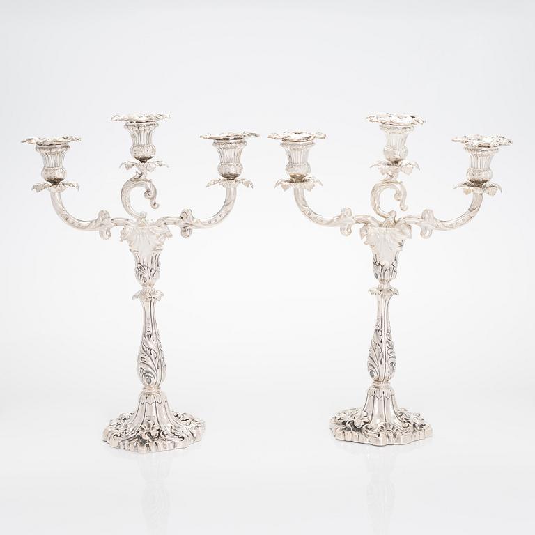 A pair of silver candelabra, maker's mark of Gustaf Möllenborg, Stockholm 1876.