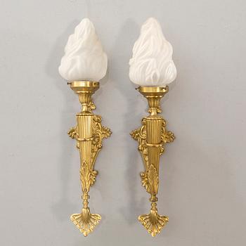 A pair of wall lamps later part of the 20th century.