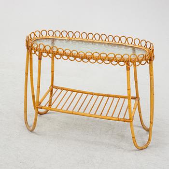 A rattan and glass flower table.