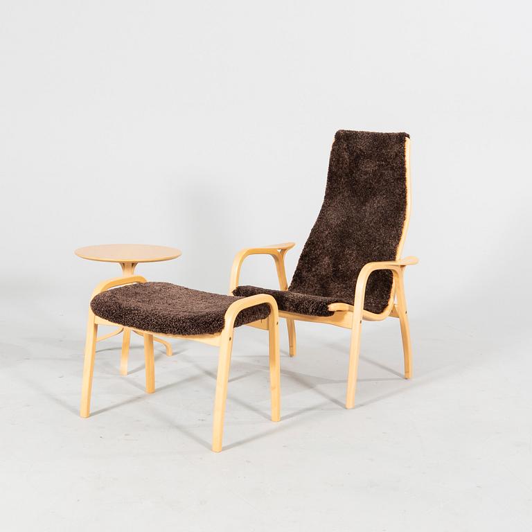 A 'Lamino' lounge chair, foot stool and side table by Yngve Ekström for Swedese.