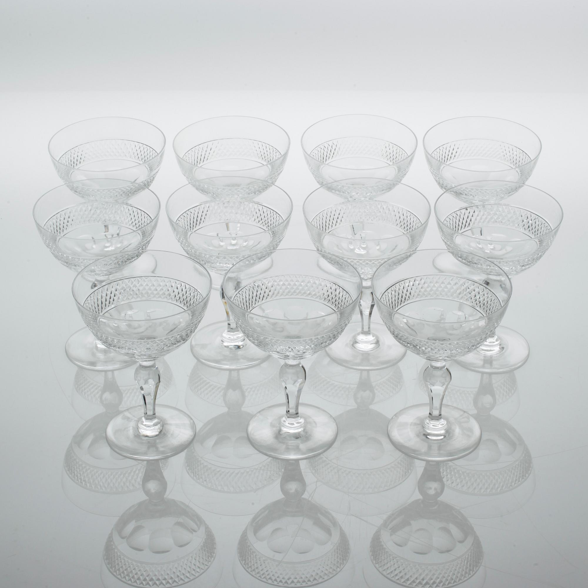 Eleven glass champagne cups, around mid 20th century.