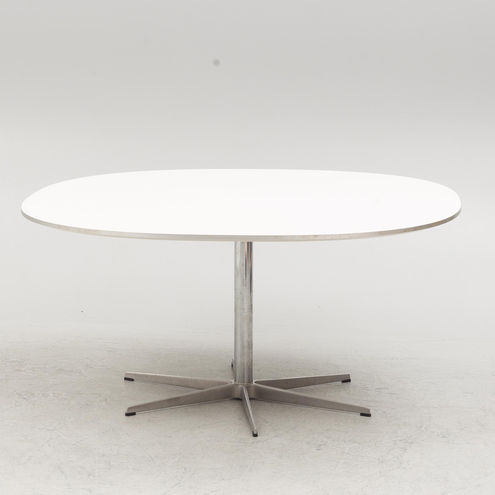 Arne Jacobsen, Bruno Mathsson & Piet Hein, a 'Super circle' dining table, Fritz Hansen, Denmark, 2007.