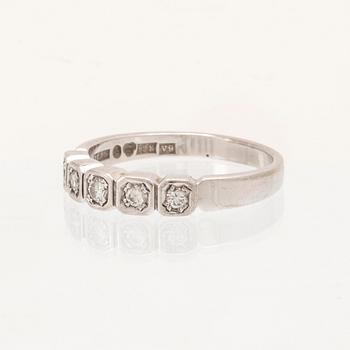 An 18K white gold half eternity ring set with round brilliant-cut diamonds.