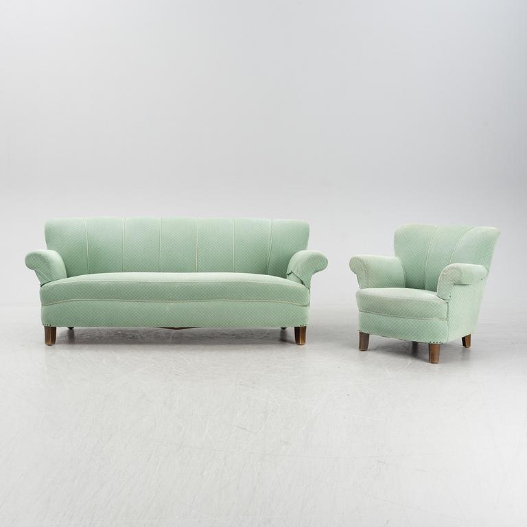 A mid 20th Century sofa and easy chair.