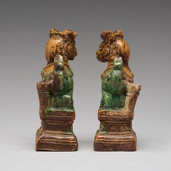 A pair of green and yellow glazed joss stick holders, Ming dynasty (1368-1644).