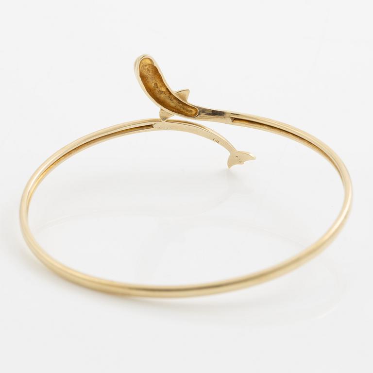 Bracelet/arm ring, 14K gold in the form of a dolphin.