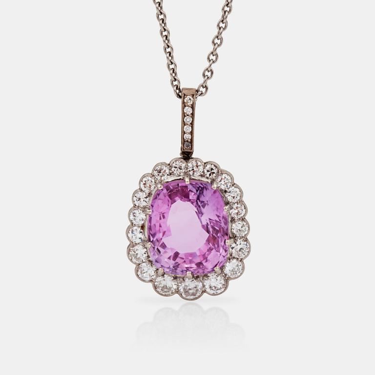 A circa 8.00 ct pink sapphire with millegrain set diamonds. Total carat weight of diamonds 0.75 ct.