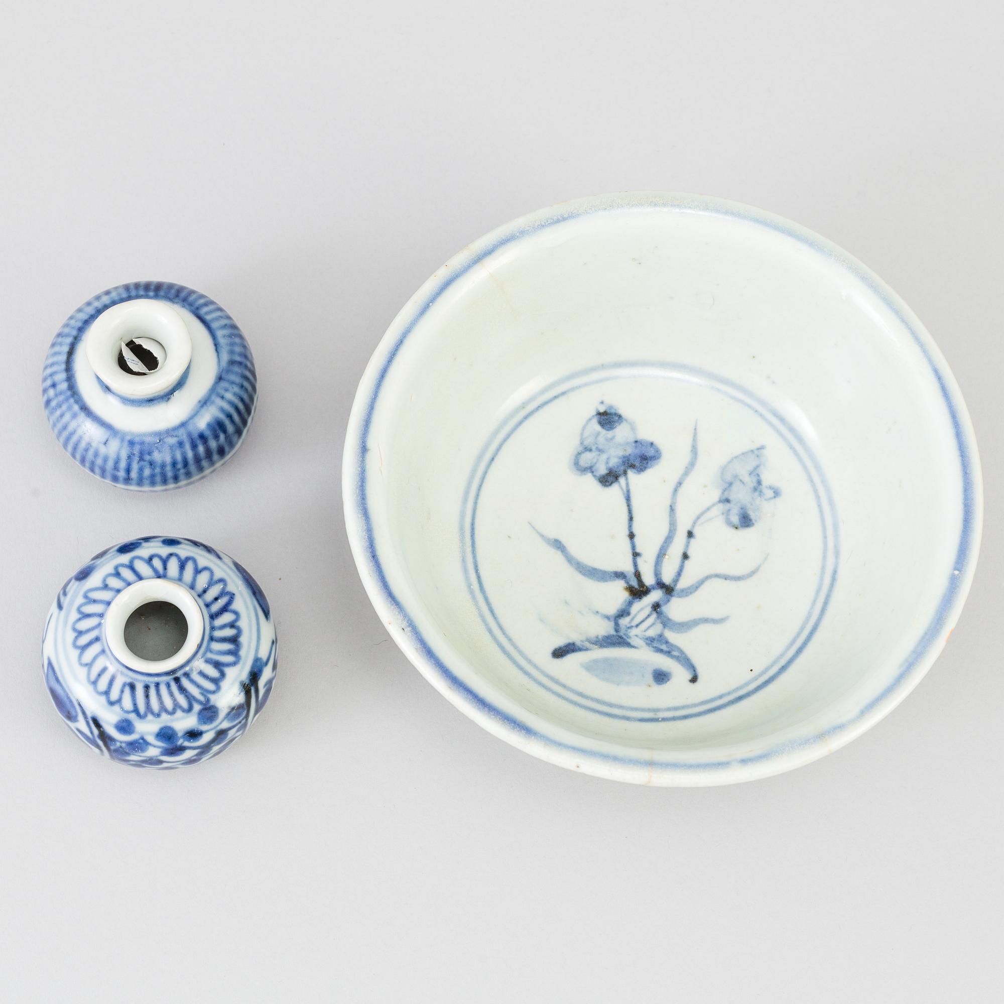 A blue and white Chinese porcelain bowl and two miniature jars for the South East Asian market, probably Ming dynasty.