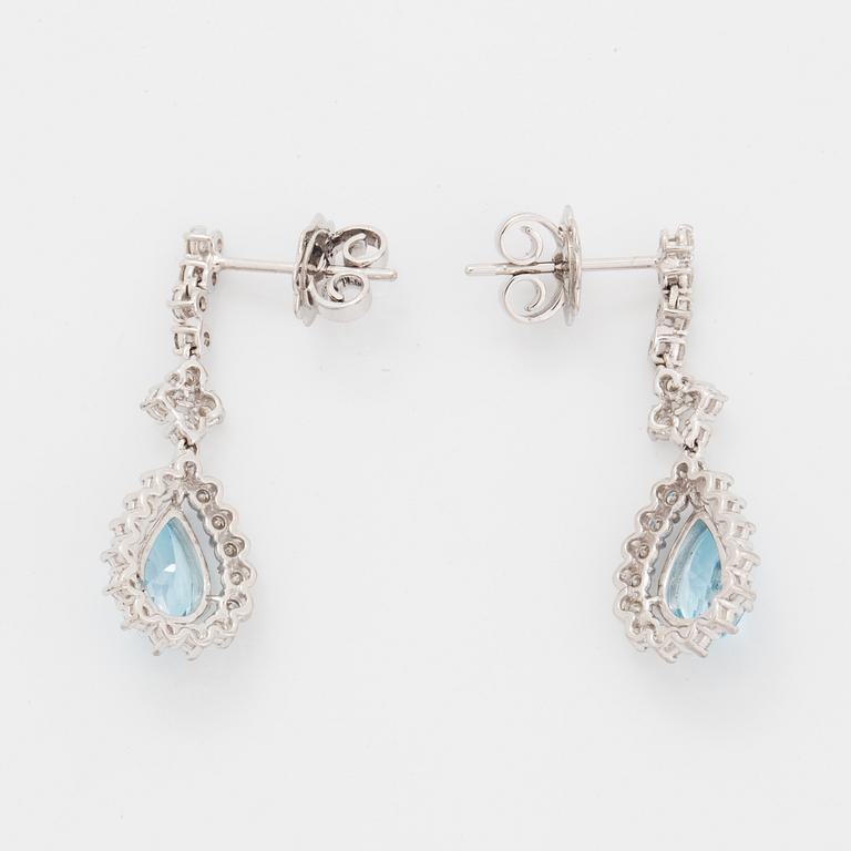 Topaz and brilliant-cut diamond earrings.
