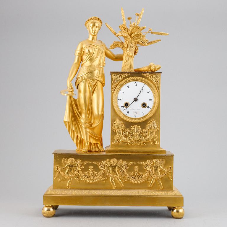 A French Empire gilt bronze mantel clock.