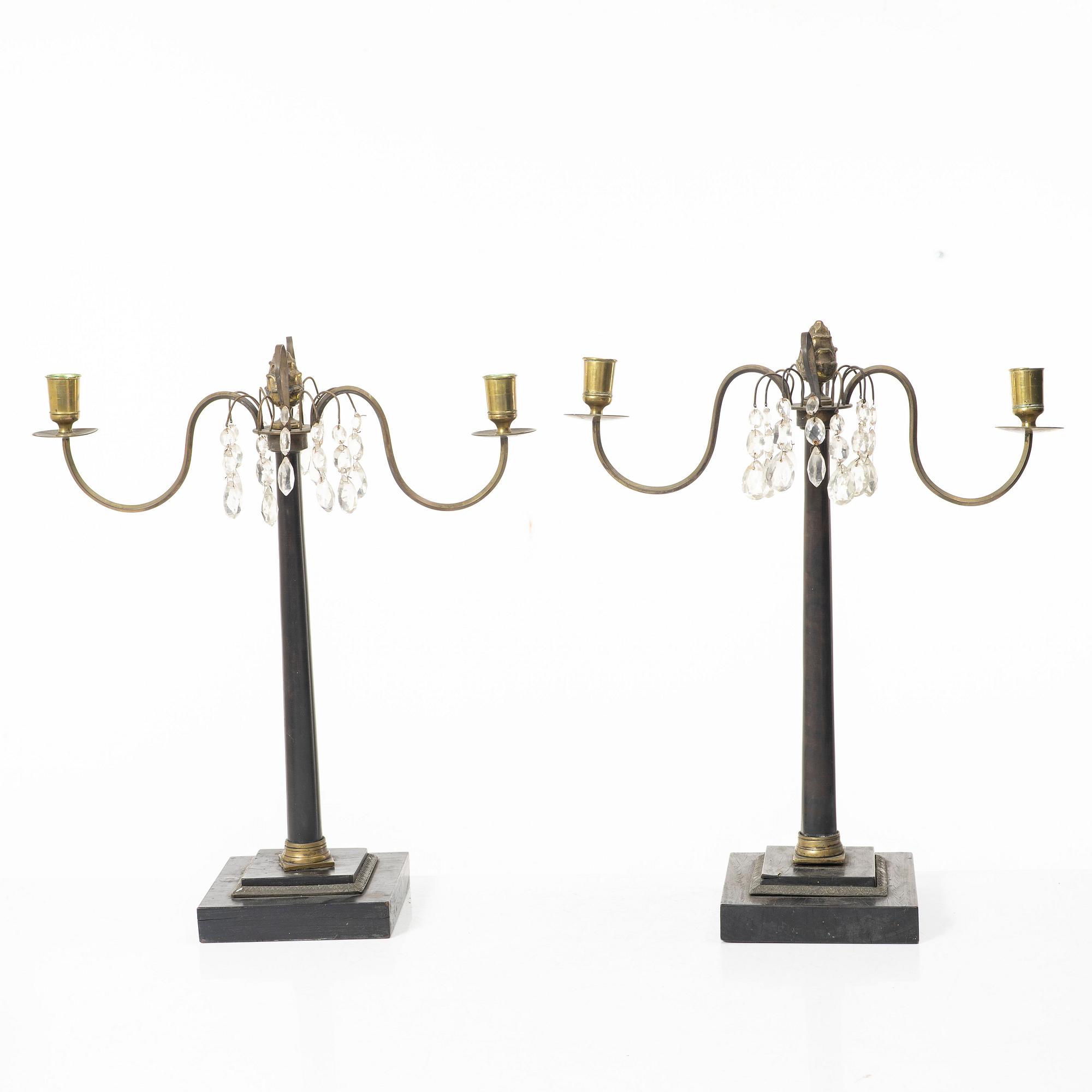 A pair of wooden candelabras, around 1900.