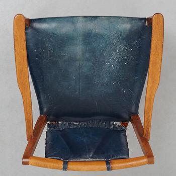 Josef Frank, a mahogany and blue leather chair for Firma Svenskt Tenn, Sweden probably 1950-60's.