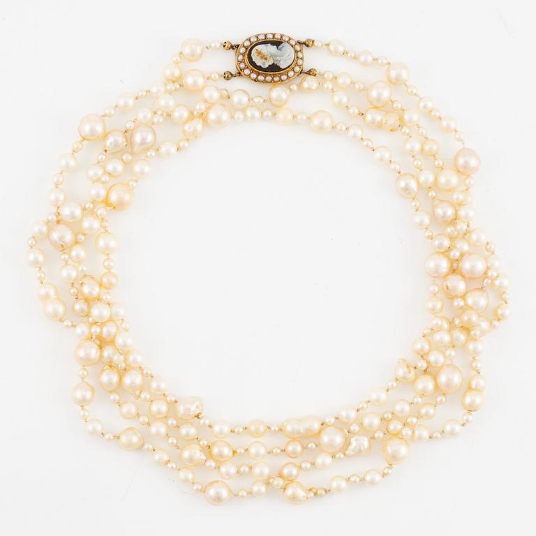 Necklace of two strands of cultured pearls, clasp 18K gold with a hardstone cameo.