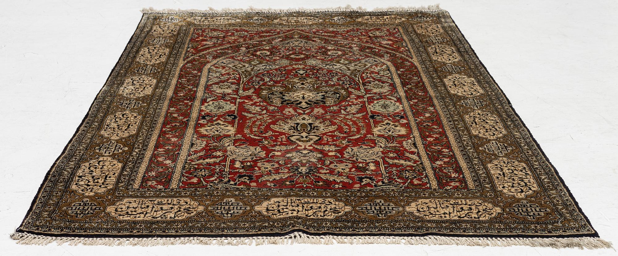 A silk Qum rug, c. 172 x 105 cm.