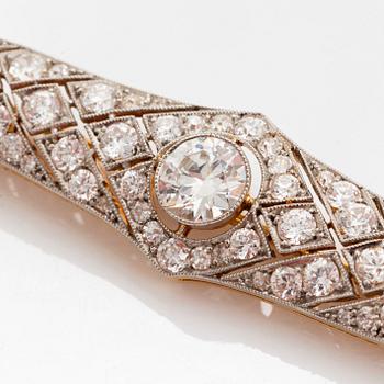Brosch platina och 14K guld med en gammalslipad diamant ca 1.05 ct kvalitet ca H si.