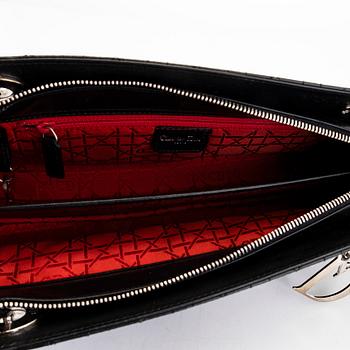 Christian Dior, a 'Lady Dior East West' bag.
