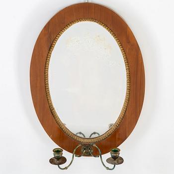 An Empire mirror sconce by Gustaf Holm (master in Stockholm from 1834). Dated 1839.