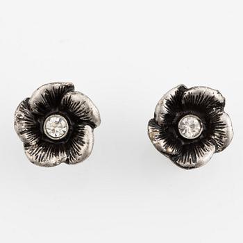 Necklace with matching earrings, white metal in floral design with glass stones.