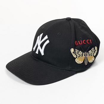 Gucci, NY Yankees baseball cap.