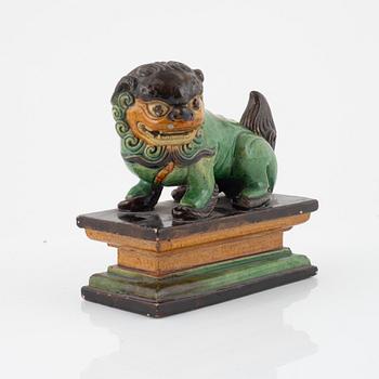 A Chinese figure of a buddhist lion, Qing dynasty, 19th Century.